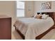 Bright bedroom featuring a window with blinds, modern bed frame with built-in bookcase at 6254 Woodhaven Village Dr, Port Orange, FL 32128