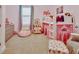 Bright bedroom with fun décor, a cozy play area and a comfortable bed at 6254 Woodhaven Village Dr, Port Orange, FL 32128