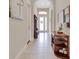 Inviting foyer features tile flooring, neutral paint, and ample natural light at 6254 Woodhaven Village Dr, Port Orange, FL 32128