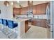 Well-equipped kitchen featuring a breakfast bar and stainless-steel appliances at 6254 Woodhaven Village Dr, Port Orange, FL 32128