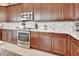 Kitchen featuring stainless steel oven and microwave, sleek countertops, and modern cabinets at 6254 Woodhaven Village Dr, Port Orange, FL 32128