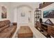 Comfortable living room showcasing tile floors, a plush sofa, stylish décor, and a media center at 6254 Woodhaven Village Dr, Port Orange, FL 32128