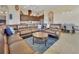 Spacious living room boasts a leather sectional, open to the kitchen and dining area at 6254 Woodhaven Village Dr, Port Orange, FL 32128