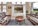 Cozy living space featuring comfortable seating and a built-in entertainment center at 6254 Woodhaven Village Dr, Port Orange, FL 32128