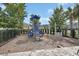 Community playground featuring slides, climbing structures, and a safety surface at 6254 Woodhaven Village Dr, Port Orange, FL 32128