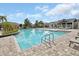 Sparkling community pool with lounge area and clear blue water at 6254 Woodhaven Village Dr, Port Orange, FL 32128