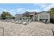 Community pool area with lounge chairs, tables, and shaded cabanas at 6254 Woodhaven Village Dr, Port Orange, FL 32128