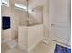 Modern walk-in shower featuring glass enclosure and tiled walls at 6254 Woodhaven Village Dr, Port Orange, FL 32128