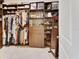 Spacious walk-in closet featuring custom shelving, cabinets, drawers, and a full-length mirror for maximum storage and convenience at 6254 Woodhaven Village Dr, Port Orange, FL 32128
