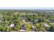 Aerial view of home in neighborhood with surrounding trees and landscaping at 701 N Tuxedo Ave, Deland, FL 32724