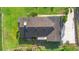 Aerial view of home showing roof, lawn, and surrounding landscaping at 701 N Tuxedo Ave, Deland, FL 32724