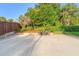 Backyard patio area with an outdoor dining table set in a park-like setting at 701 N Tuxedo Ave, Deland, FL 32724