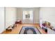 Unfurnished bonus room with wood floors, natural light, and classic detailing at 701 N Tuxedo Ave, Deland, FL 32724