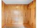 Empty bonus room with wood paneling and hardwood floors at 701 N Tuxedo Ave, Deland, FL 32724