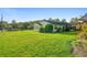 Charming home with a large grassy yard and mature trees at 701 N Tuxedo Ave, Deland, FL 32724