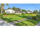Charming single-story home with lush green lawn and mature landscaping at 701 N Tuxedo Ave, Deland, FL 32724