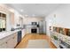 Eat-in kitchen featuring stainless steel appliances, counters, and ample cabinet space at 701 N Tuxedo Ave, Deland, FL 32724