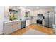Eat-in kitchen with stainless steel appliances, countertops, and bright lighting at 701 N Tuxedo Ave, Deland, FL 32724