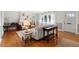 Cozy living room featuring hardwood floors, white sofa, and fireplace at 701 N Tuxedo Ave, Deland, FL 32724