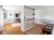 Bright living room with hardwood floors, built-in shelving and dining area at 701 N Tuxedo Ave, Deland, FL 32724