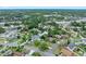Aerial view of a neighborhood with lush landscaping and well-kept lawns at 718 Sleepy Hollow Dr, Port Orange, FL 32127