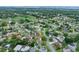 Aerial view of a neighborhood with mature landscaping and well-maintained homes at 718 Sleepy Hollow Dr, Port Orange, FL 32127