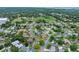 Aerial view of a residential neighborhood featuring lush trees at 718 Sleepy Hollow Dr, Port Orange, FL 32127
