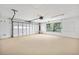 Spacious two-car garage with a large door and a window for natural light at 718 Sleepy Hollow Dr, Port Orange, FL 32127