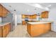 Open kitchen featuring wood cabinets and stainless steel appliances at 718 Sleepy Hollow Dr, Port Orange, FL 32127