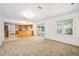 Open-concept living room with view into kitchen with stainless appliances at 718 Sleepy Hollow Dr, Port Orange, FL 32127