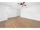 Open living area with contemporary vinyl floors, white walls, and versatile space for furniture arrangement and living at 718 Sleepy Hollow Dr, Port Orange, FL 32127
