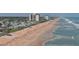 Breathtaking aerial view of the beach, highlighting the property's prime oceanfront location at 8 Ocean Dunes Dr, Ormond Beach, FL 32176