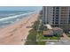 Panoramic aerial view of the beach, adjacent high-rise condos and neighborhood at 8 Ocean Dunes Dr, Ormond Beach, FL 32176