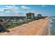 Stunning aerial view of the beach, showcasing the property's location with easy beach access at 8 Ocean Dunes Dr, Ormond Beach, FL 32176