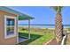 Cozy backyard view of the ocean, featuring a well-maintained lawn and direct beach access at 8 Ocean Dunes Dr, Ormond Beach, FL 32176
