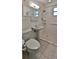 Bathroom featuring a walk-in shower, a pedestal sink, and tiled flooring at 8 Ocean Dunes Dr, Ormond Beach, FL 32176