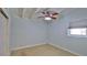 Empty bedroom with a ceiling fan and a window at 8 Ocean Dunes Dr, Ormond Beach, FL 32176
