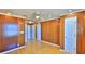 Spacious bedroom featuring wood paneling, recessed lights, and access to multiple closets at 8 Ocean Dunes Dr, Ormond Beach, FL 32176