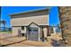 Back of house with grey shed sitting on paver patio and beach view at 8 Ocean Dunes Dr, Ormond Beach, FL 32176