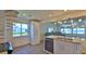 Kitchen and living room area featuring granite countertops, stainless steel appliances, and ocean views at 8 Ocean Dunes Dr, Ormond Beach, FL 32176