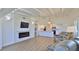 Bright living room with a fireplace and open-concept kitchen at 8 Ocean Dunes Dr, Ormond Beach, FL 32176