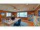 Home office featuring hardwood floors, ocean views, a ceiling fan, and lots of natural light at 8 Ocean Dunes Dr, Ormond Beach, FL 32176
