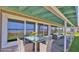 Outdoor patio area with dining table and seating, offering stunning ocean views at 8 Ocean Dunes Dr, Ormond Beach, FL 32176