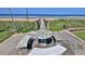 Charming outdoor seating area with a unique mosaic tile table, perfect for enjoying the ocean view at 8 Ocean Dunes Dr, Ormond Beach, FL 32176