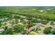 Aerial view of neighborhood with wetlands and the home marked by an arrow at 809 E 14Th Ave, New Smyrna Beach, FL 32169