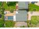 An aerial view of the property showcasing the pool, patio and the surrounding landscaping at 809 E 14Th Ave, New Smyrna Beach, FL 32169