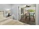 This main bedroom has view through the open french doors to a screened pool and sitting area at 809 E 14Th Ave, New Smyrna Beach, FL 32169