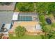 Screened pool and brick patio area with fenced yard, shed and mature landscaping at 809 E 14Th Ave, New Smyrna Beach, FL 32169