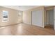 Comfortable bedroom with hardwood floors and double door closet at 825 Wells Dr, South Daytona, FL 32119