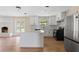 Modern kitchen featuring white cabinets, an island, stainless steel appliances, and an open layout at 825 Wells Dr, South Daytona, FL 32119